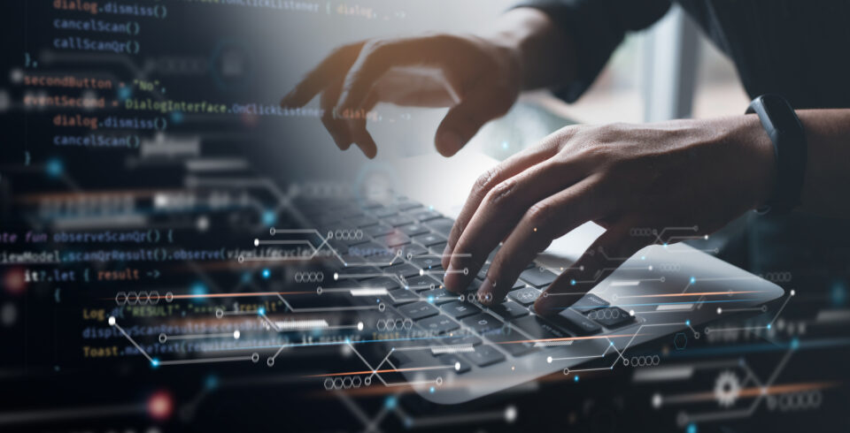Digital technology, software development concept. coding programmer working on laptop with circuit board and javascript on virtual screen